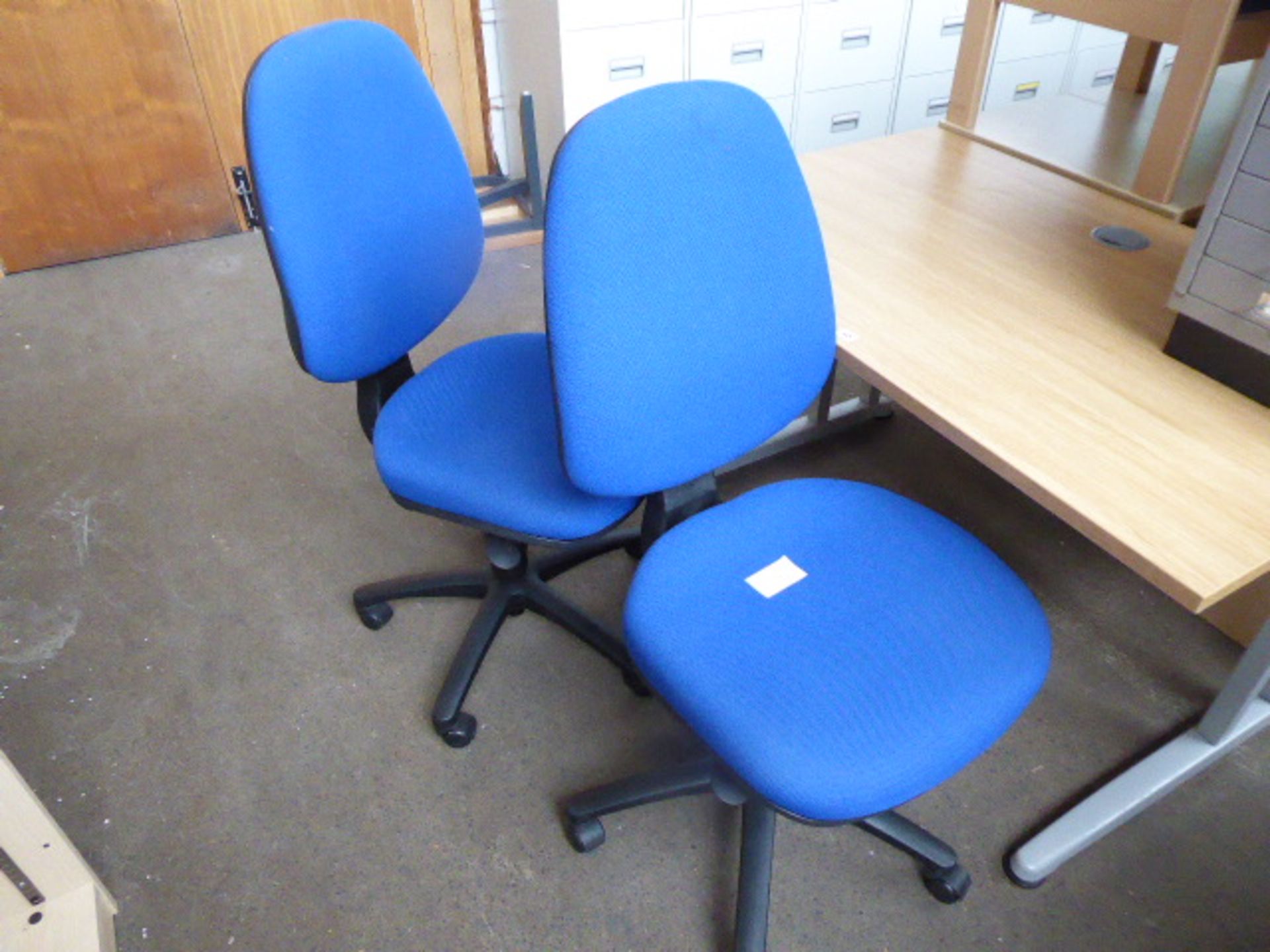 2 blue cloth swivel chairs