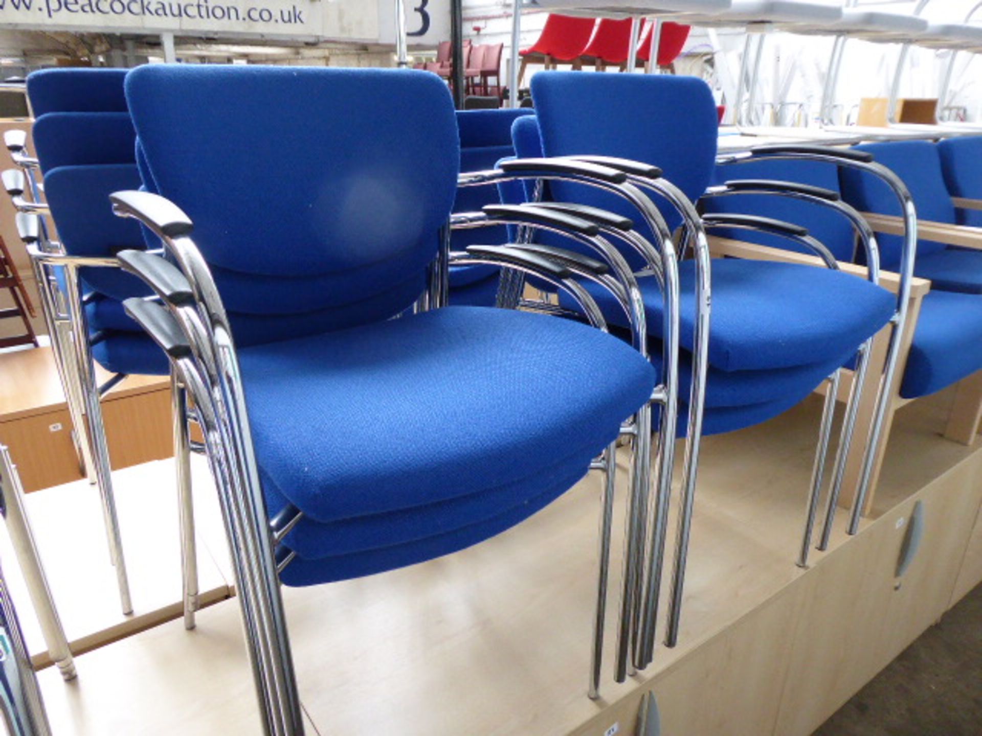 6 Senator blue cloth stacking chairs