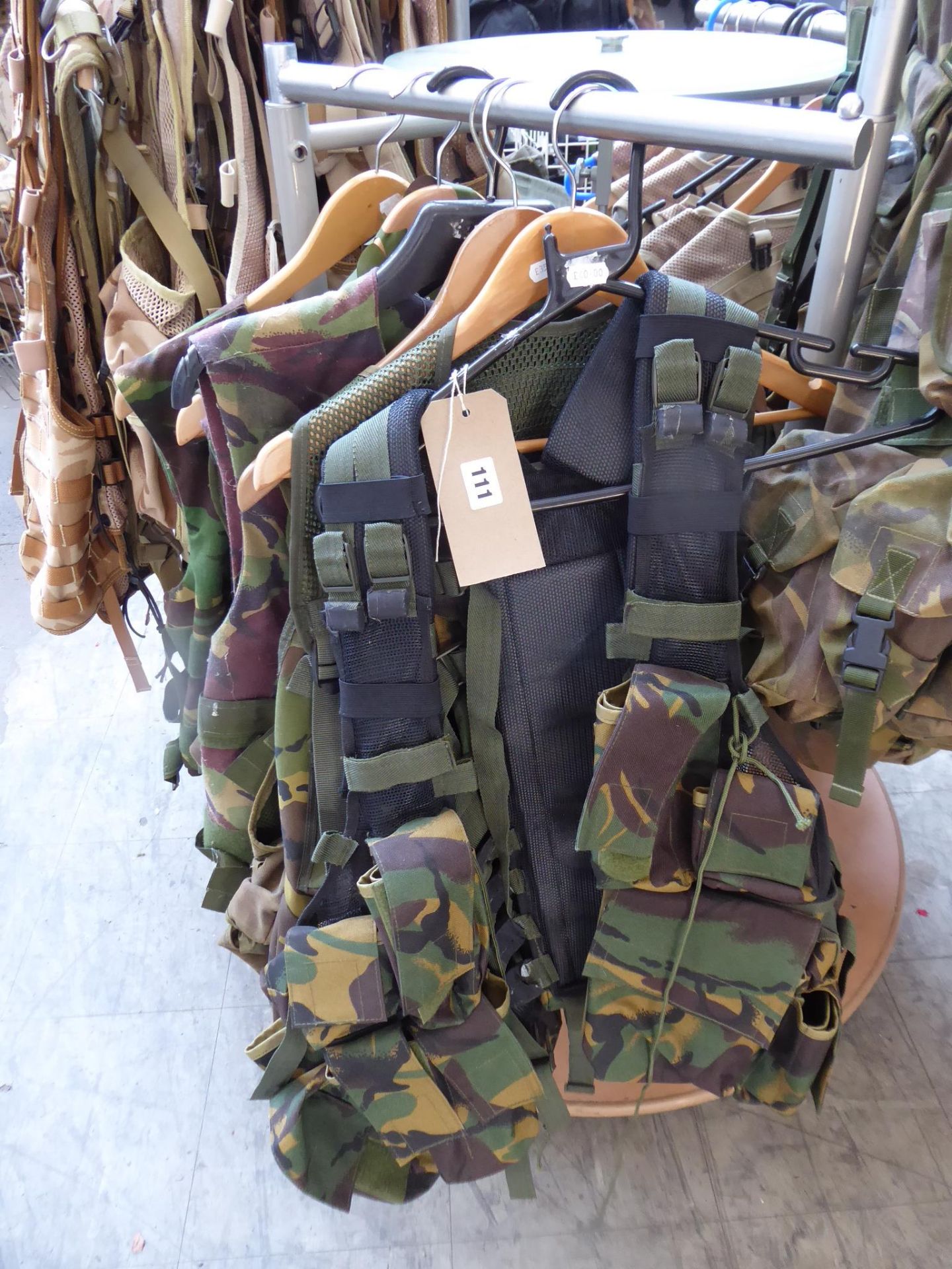 Seven forest green tactical vests