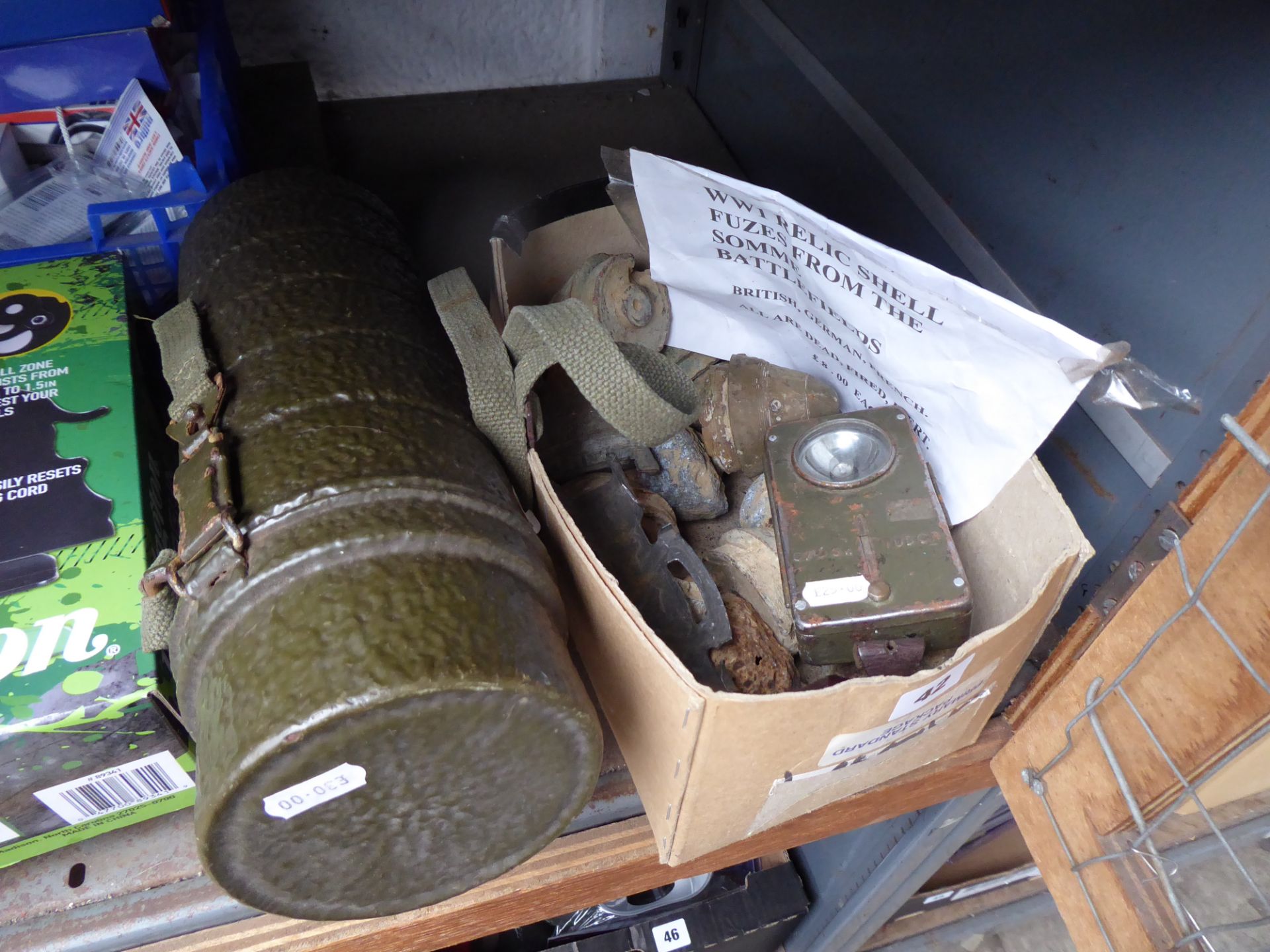 Group of First World War relics and a green shell case