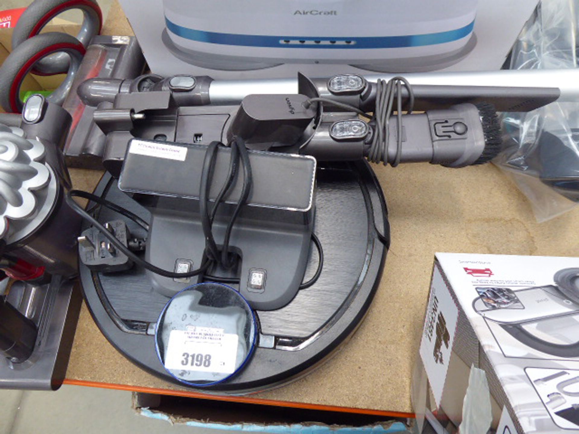 Vacuum cleaning D Bot robot with a charger