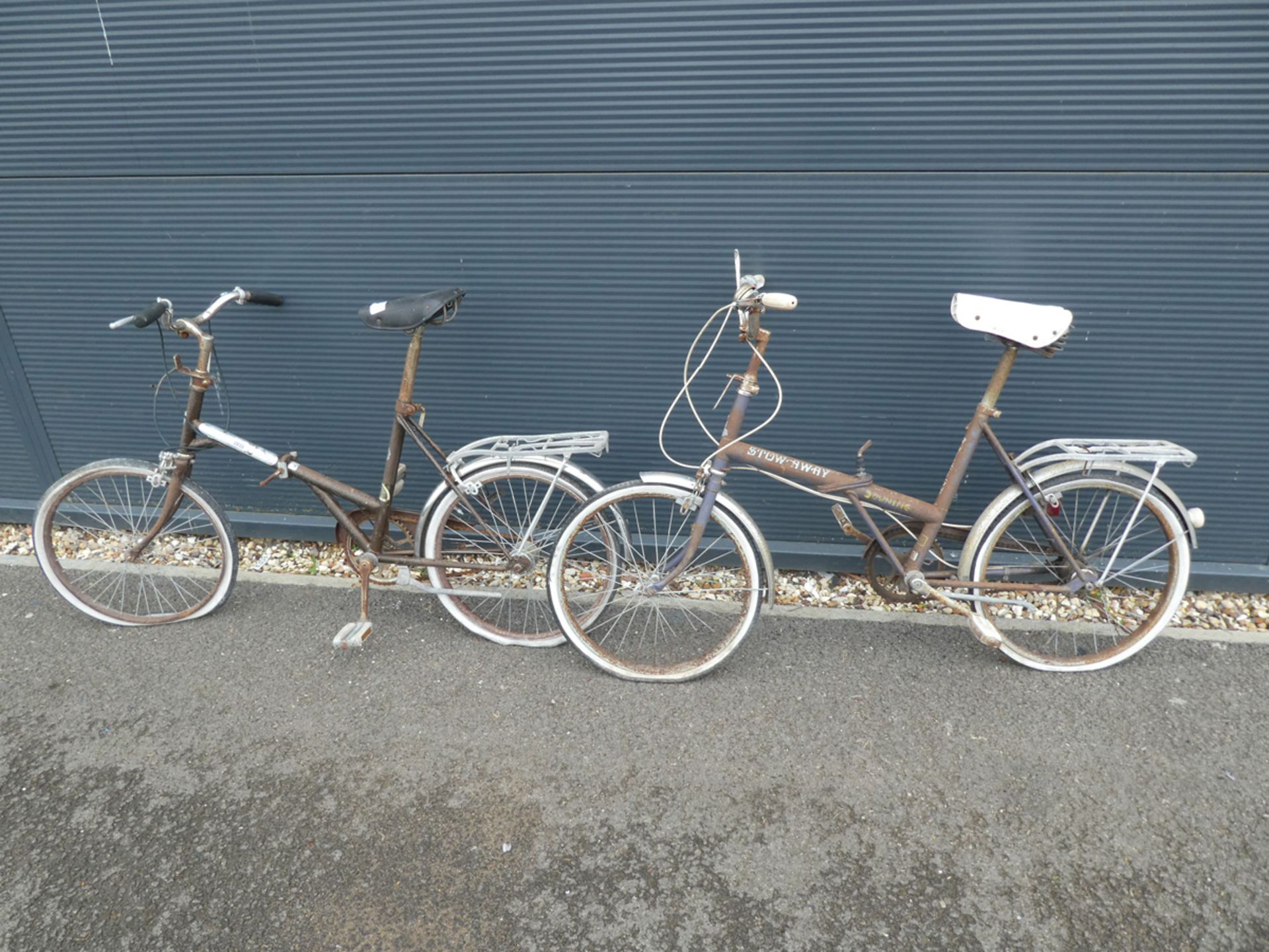 2 folding Stowaway bikes in brown