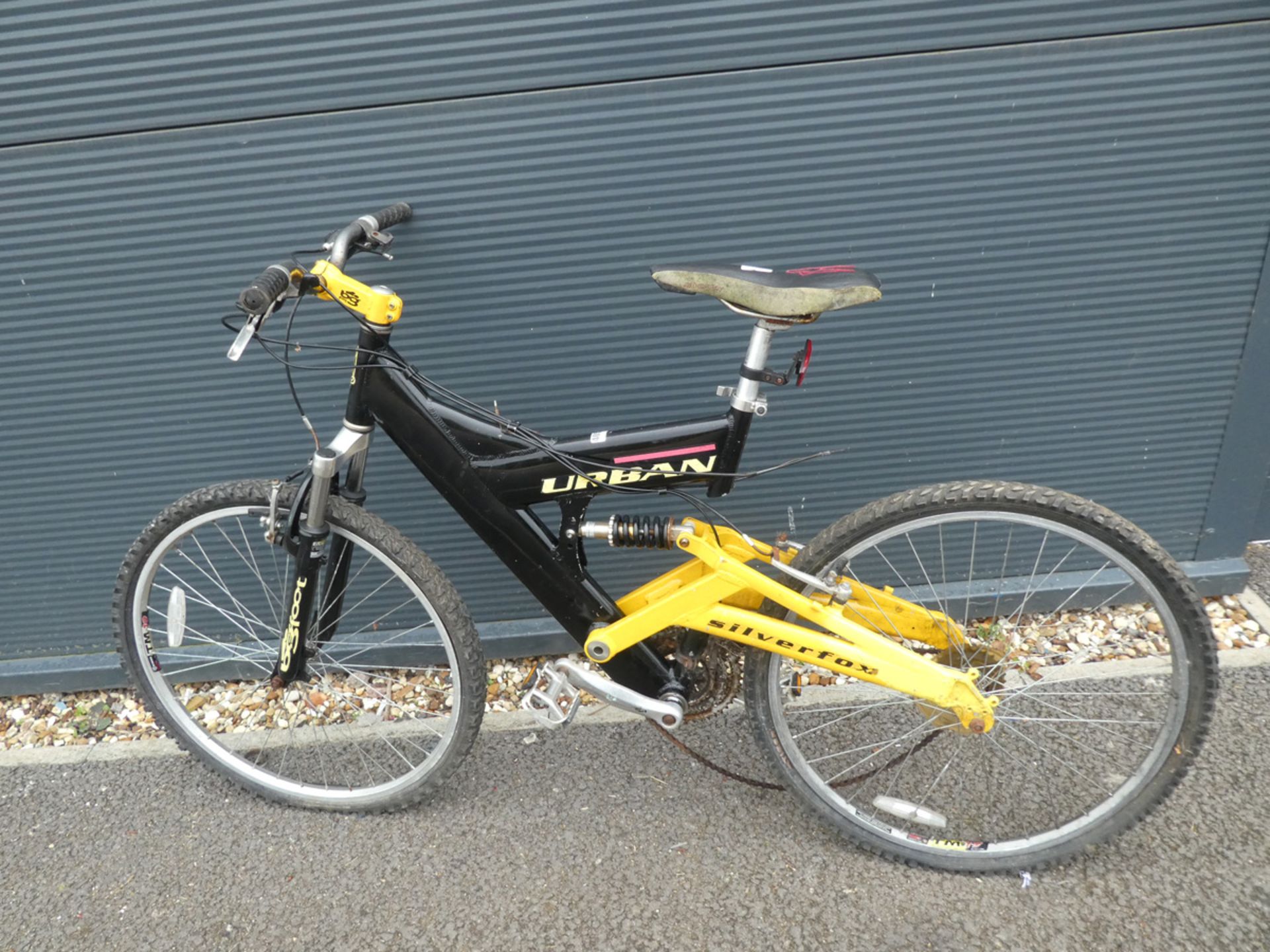 Urban full suspension mountain bike in black and yellow