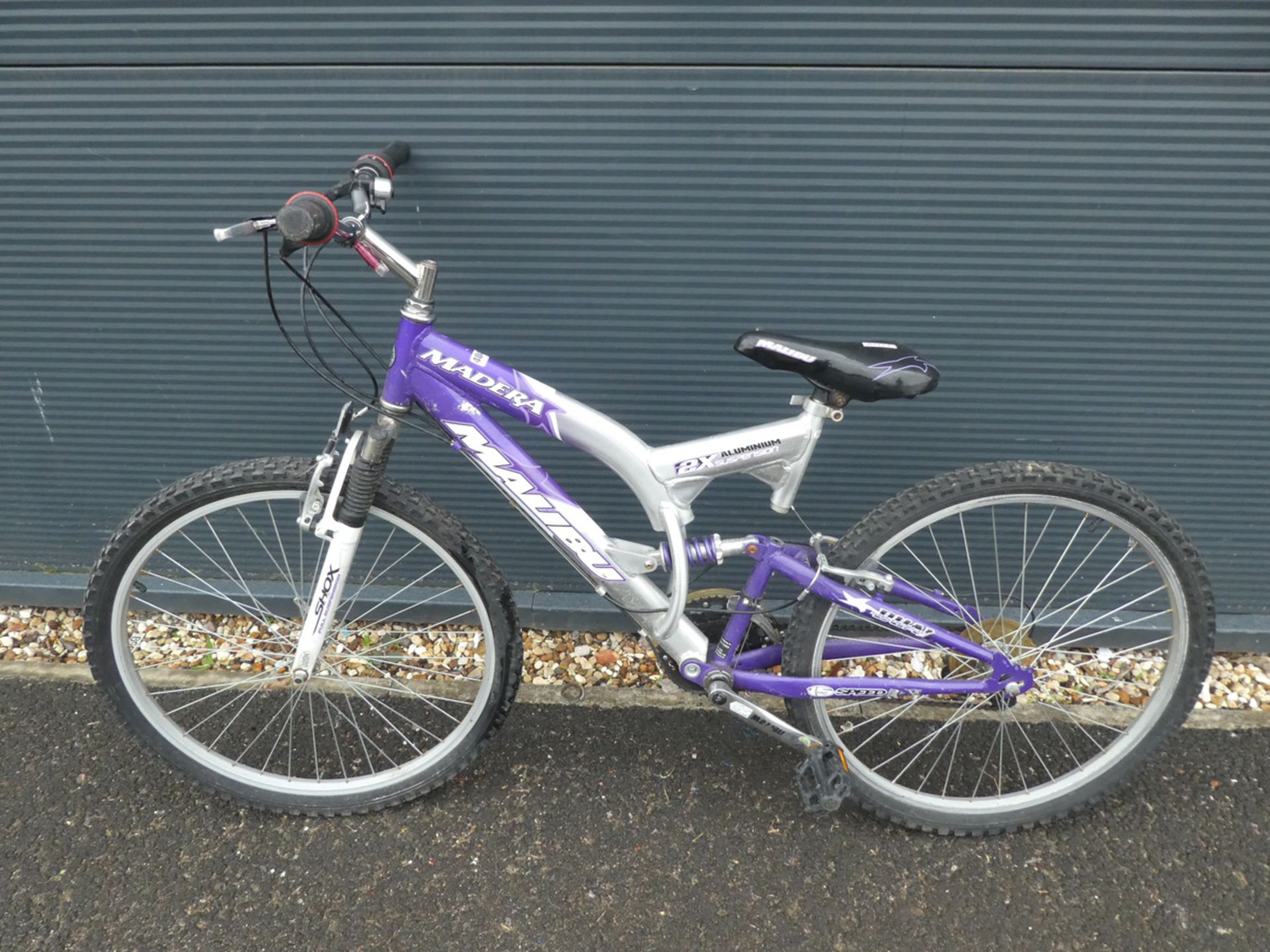 Full suspension Madera mountain bike in silver and purple