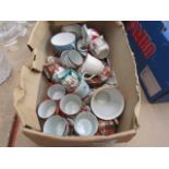 2 boxes containing wine glasses and Japanese export tea cups and saucers