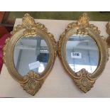 Pair of oval mirrors in gilt frames