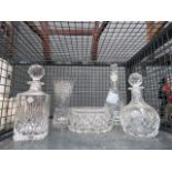 Cage containing decanters, glass vase, and bowl