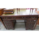 Reproduction mahogany twin pedestal desk with green leather surface