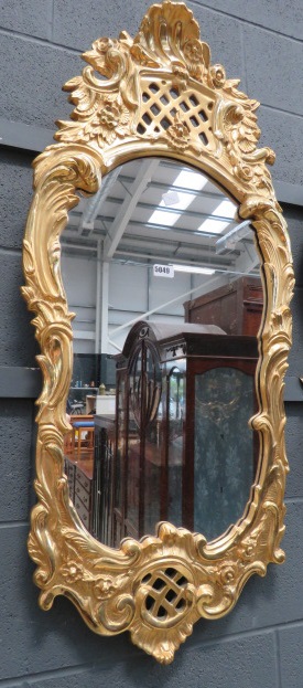 Mirror in ornate gilt frame