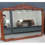 Mirror in carved wooden frame