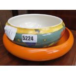 2 orange and floral decorated bowls