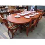 Reproduction yew extending dining table plus six chairs to include two carvers