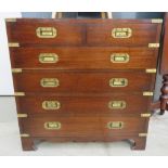 Small Campaign style chest of two over four drawers