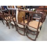 Eight carved oak dining chairs with upholstered seats