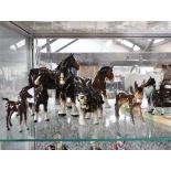 Half shelf of various horse themed ornaments incl. Beswick foal,Beswick Shire horse, Goebel ass,