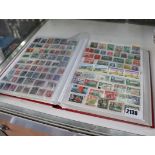 Stamp album containing worldwide stamps, mainly British Empire and Commonwealth