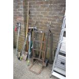 Collection of various outdoor garden tools incl. spade, shears, brush, pickaxe, axe and metal sack