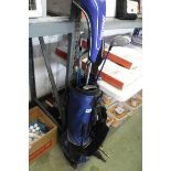 Ping golf bag containing mainly Ping golf clubs with 2 sporting umbrellas, cricket bat, tennis