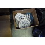 Box containing mixed branded used golf balls