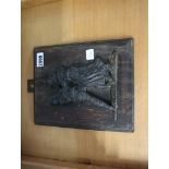 Cast iron Punch and Judy plaque mounted on oak backboard