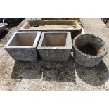 1212 Pair of square concrete planters with a circular concrete planter