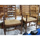 Pair of oak rush seated carver chairs