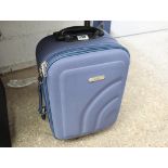 Small blue wheeled hand luggage case