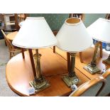 Pair of brass fluted table lamps with conical cream shades