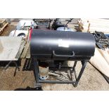 Barrel style charcoal BBQ on trolley