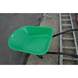 Green plastic wheelbarrow