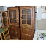 Pair of dark oak corner display cabinets