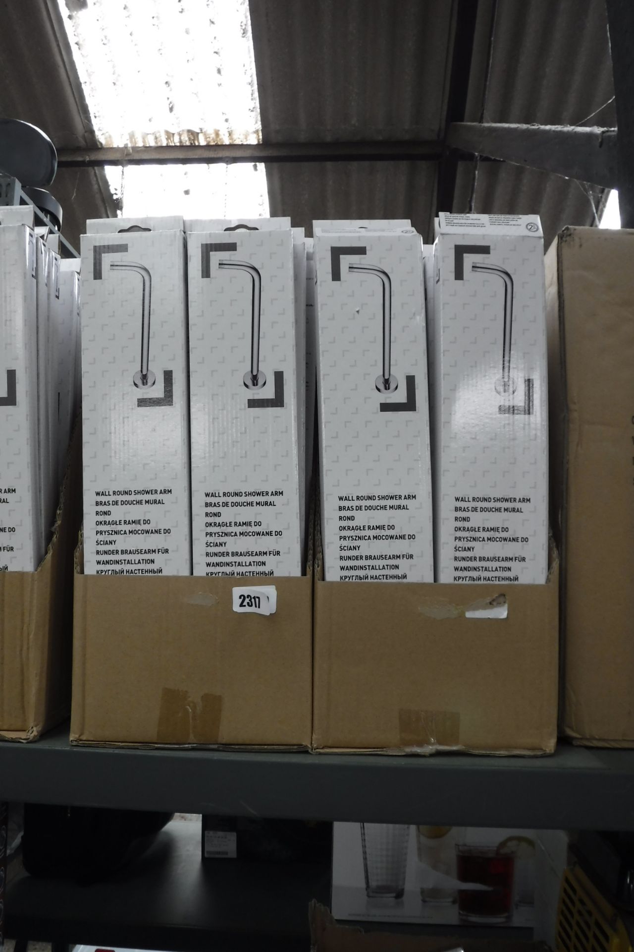 2310 2 boxes containing 40 wall-round shower arms