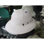 White plastic hat marked 'Made in USA, Midwest Helmets'