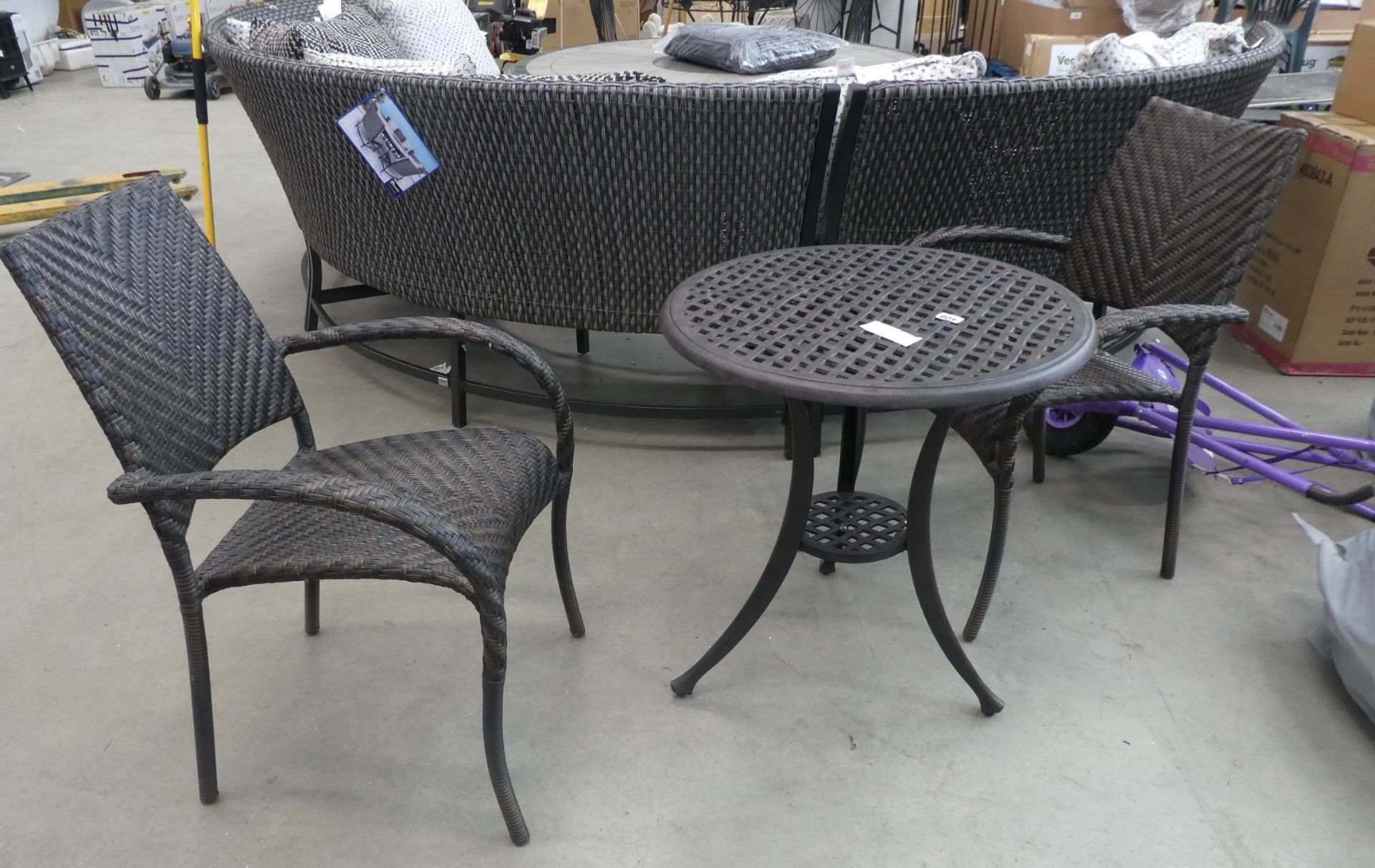 Small round garden table and 2 rattan style chairs