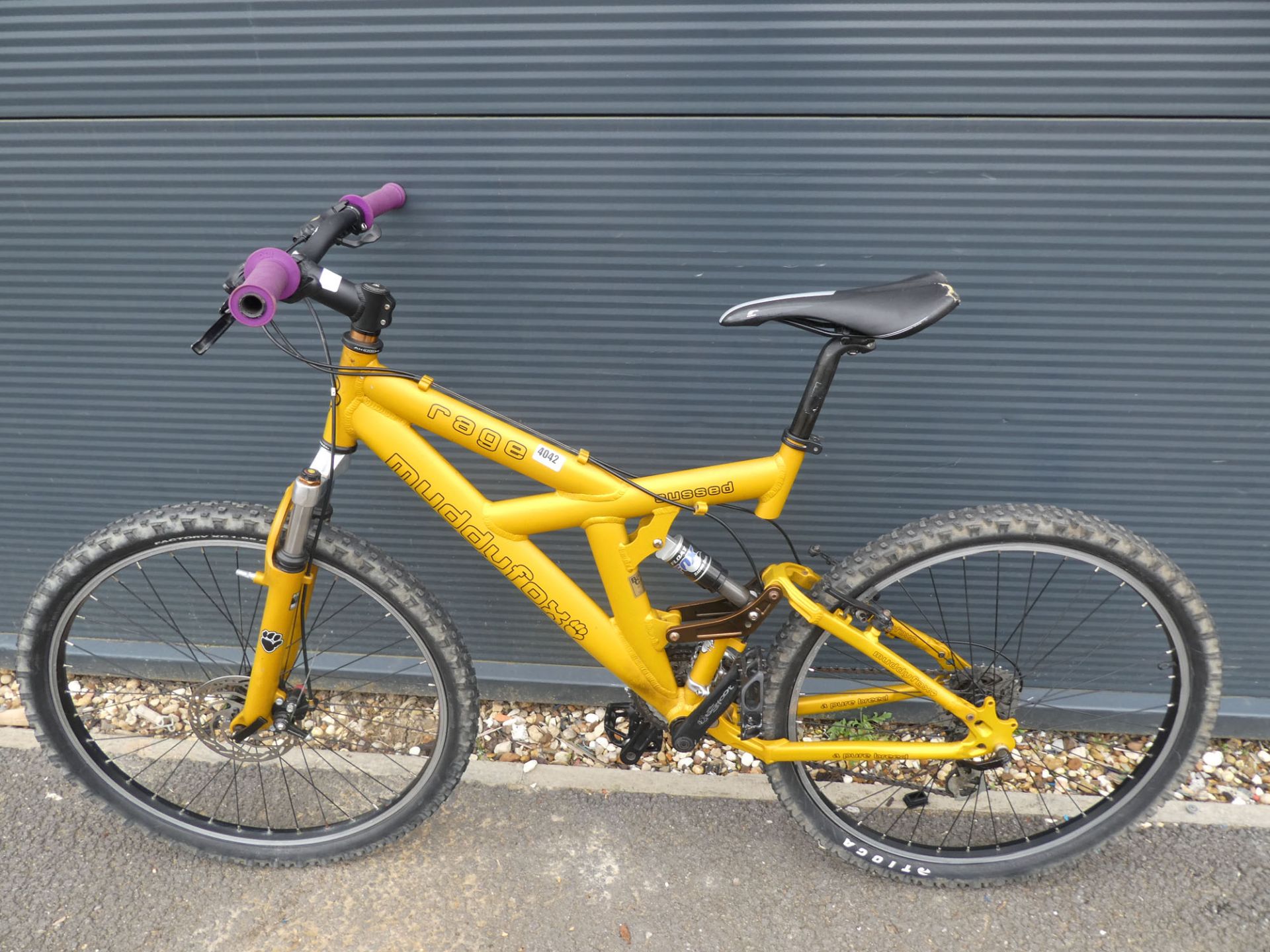 Muddy Fox yellow mountain bike