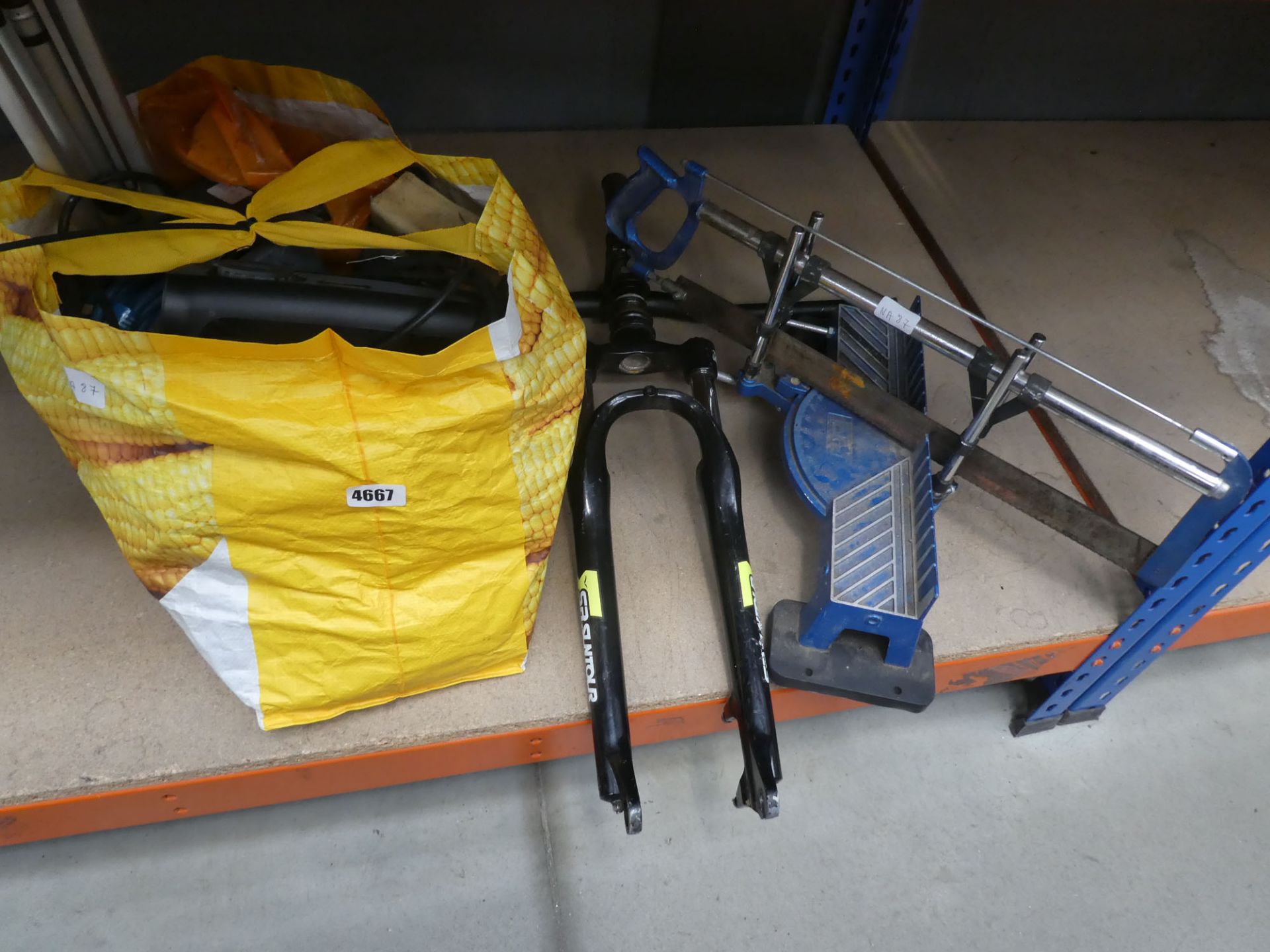 Bike forks and handlebars, projector, extension cable, mitre saw and other items