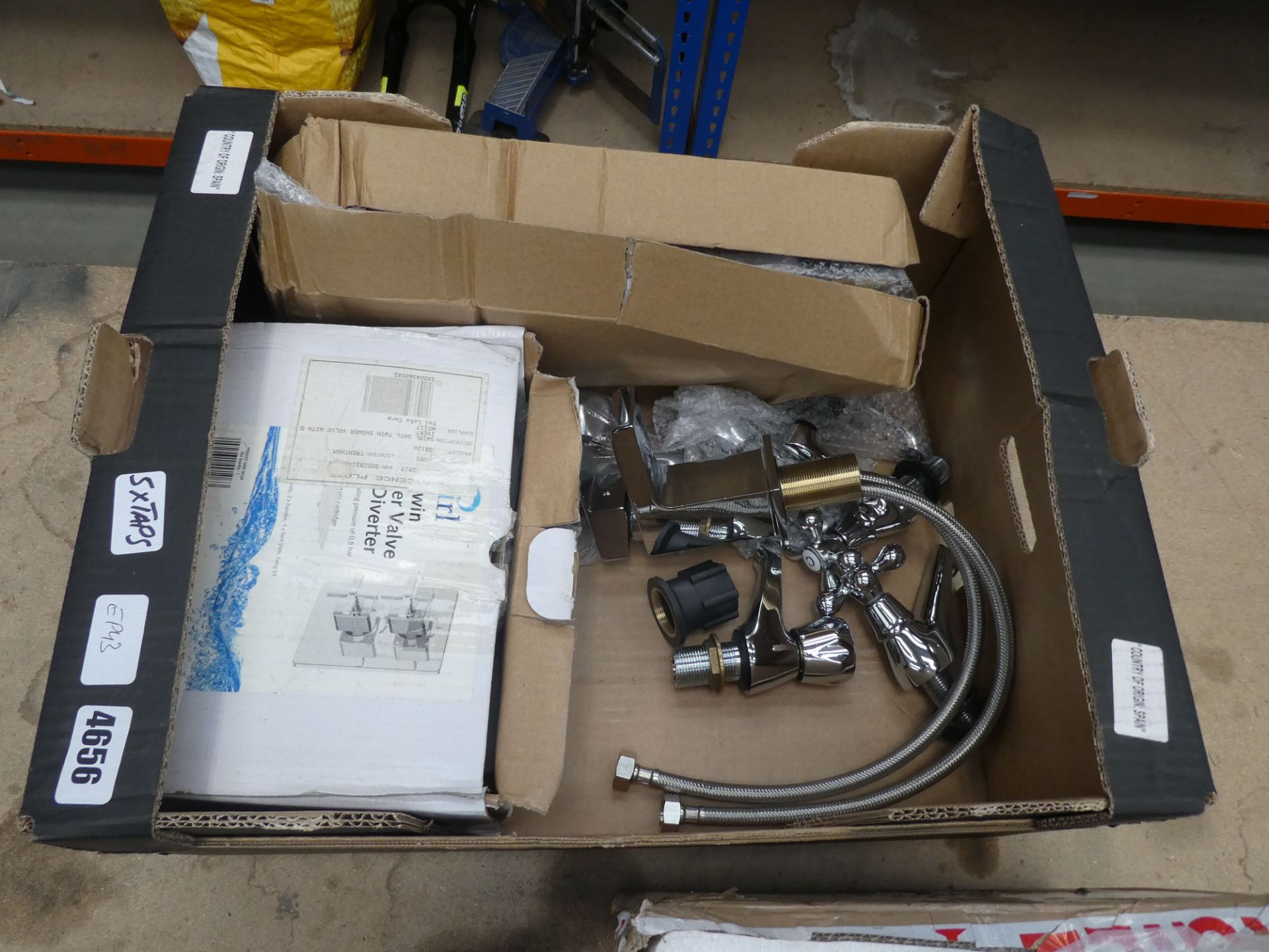 Box of assorted taps and shower valves