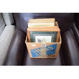 Box containing a quantity of floral prints, picture frames and urban and rustic prints