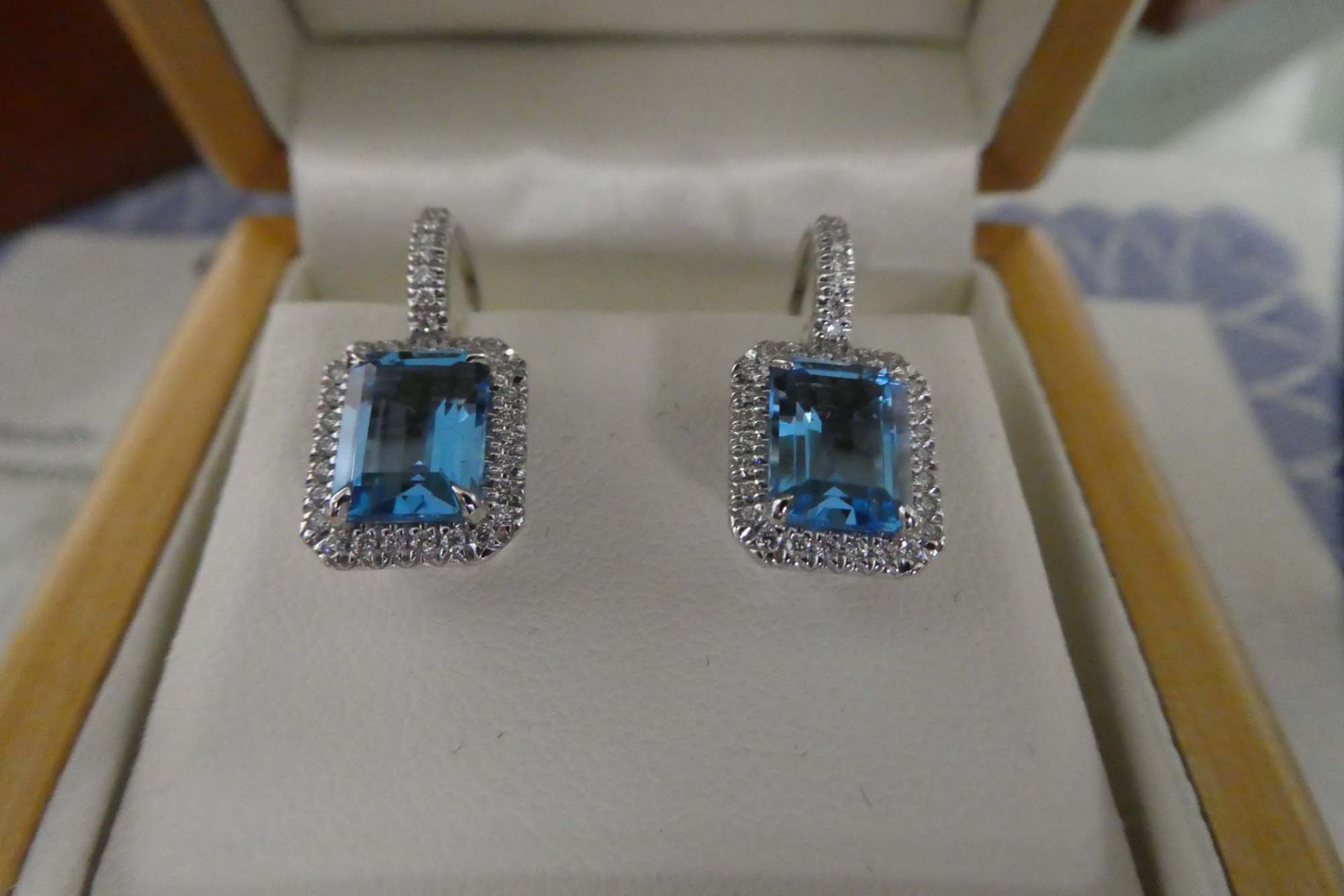 18kt white gold blue topaz and diamond earrings with lever backs with case and certificate