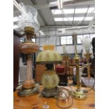 Two china and glazed oil lamps plus a two branch brass finished table lamp Wick turner bent,