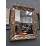 Rectangular bevelled mirror in ornate frame