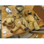 4 distressed teddy bears plus a toy wooden dog