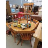 5207 Circular pine dining table plus 6 stick back chairs