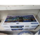 2 boxes of jigsaw puzzles