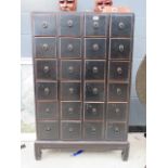 Black painted Chinese inspired 24 drawer storage cabinet