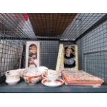 Cage containing childrens dolls, stamp albums and cups and saucers