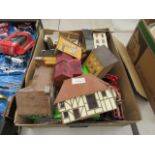 Box containing diecast cars, buses and cardboard scenery buildings