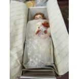Boxed porcelain doll plus 2 boxes containing ornamental animal figures, cottage plus a rolling pin