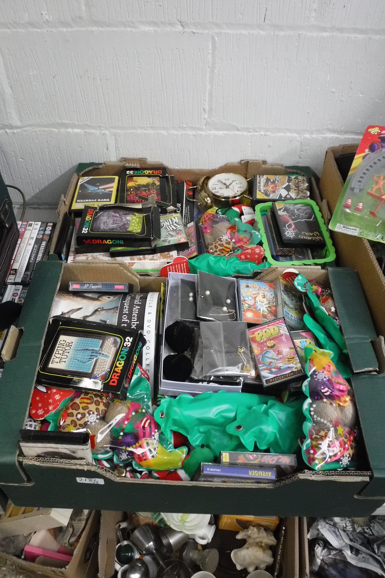 2 boxes of mixed items incl. Dragon 32 games, cat Christmas treat balls, cassettes, etc.