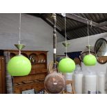 3 lime green coloured ceiling light fixtures